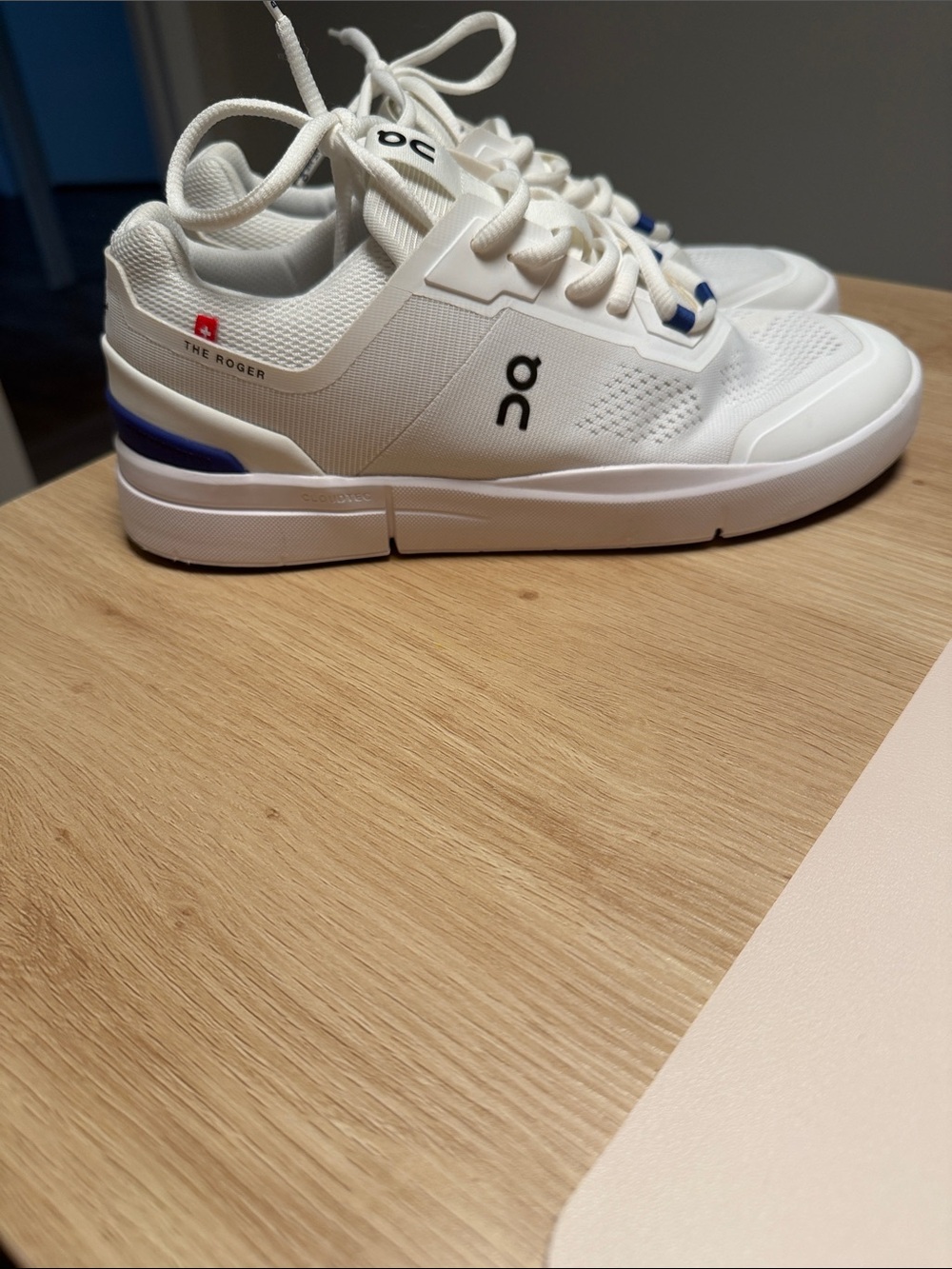 On Running White Sneakers with Blue Accents